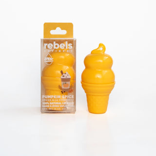 A yellow gourd-shaped lip balm next to its retail packaging box, labeled 'rebels SPICERS' and 'PUMPKIN SPICE'. The product is shown on a clean white background.