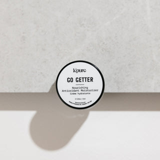 Kpure Go Getter moisturizer jar on a light gray background