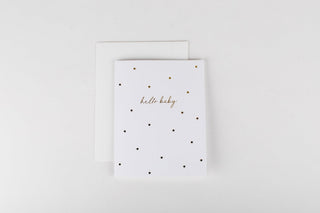White card with black polka dots and 'hello baby' text on a white background