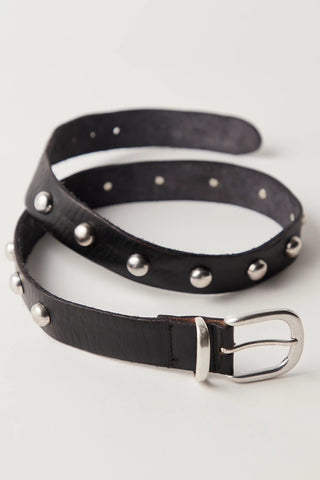 Black leather belt with silver studs and buckle on a light gray background