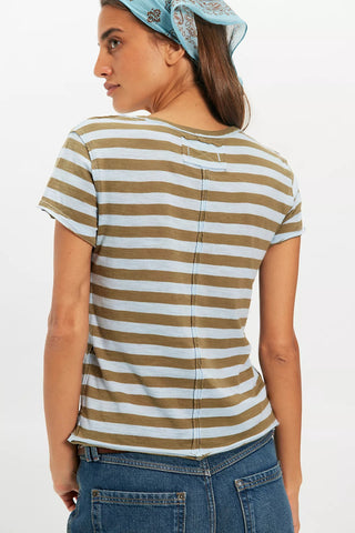 Woman wearing a striped t-shirt and jeans on a white background