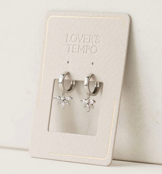 Silver hoop earrings on a 'Lover's Tempo' branded card against a white background