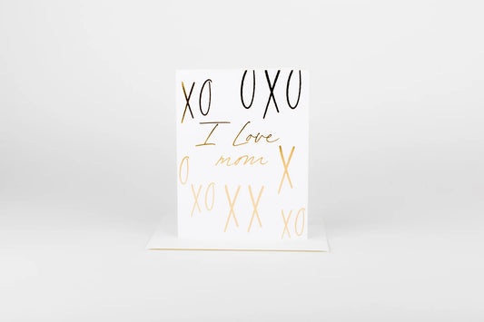 White card with gold and black text on a white background
