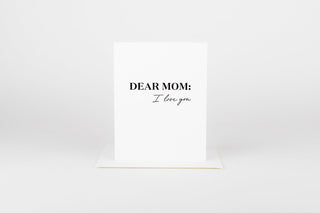 Note card with 'Dear Mom: I love you' text on a white background