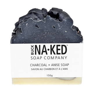 Bar of charcoal soap with 'Buck Naked Soap Company' label on a white background