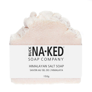A bar of Himalayan Salt Soap by Buck Naked Soap Company, with a pinkish hue and white labeling.