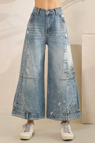 Wide-leg jeans with a neutral background