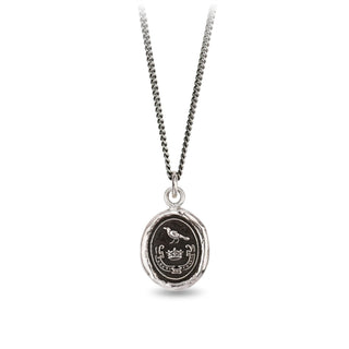 Silver necklace with a round pendant featuring a bird design on a white background