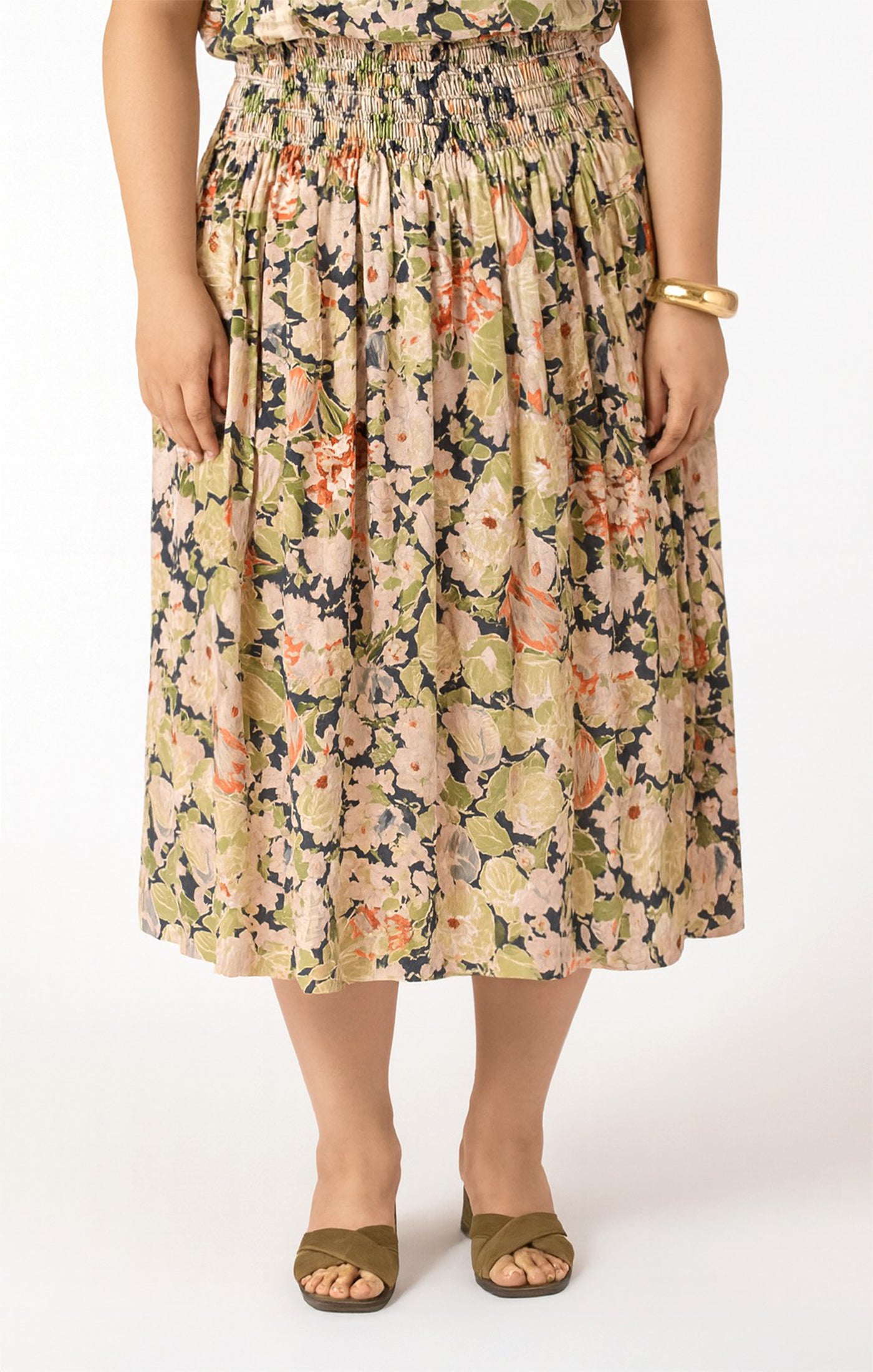 Person wearing a floral dress on a white background