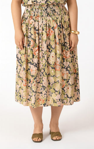 Person wearing a floral dress on a white background