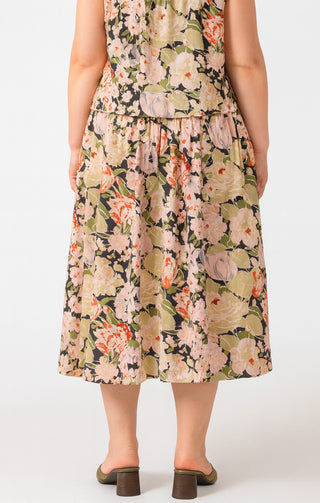 Woman wearing a floral dress on a white background