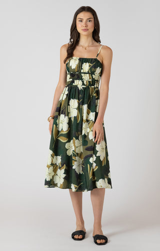 Woman wearing a floral dress on a white background