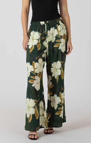 Floral-patterned pants worn by a person on a plain background