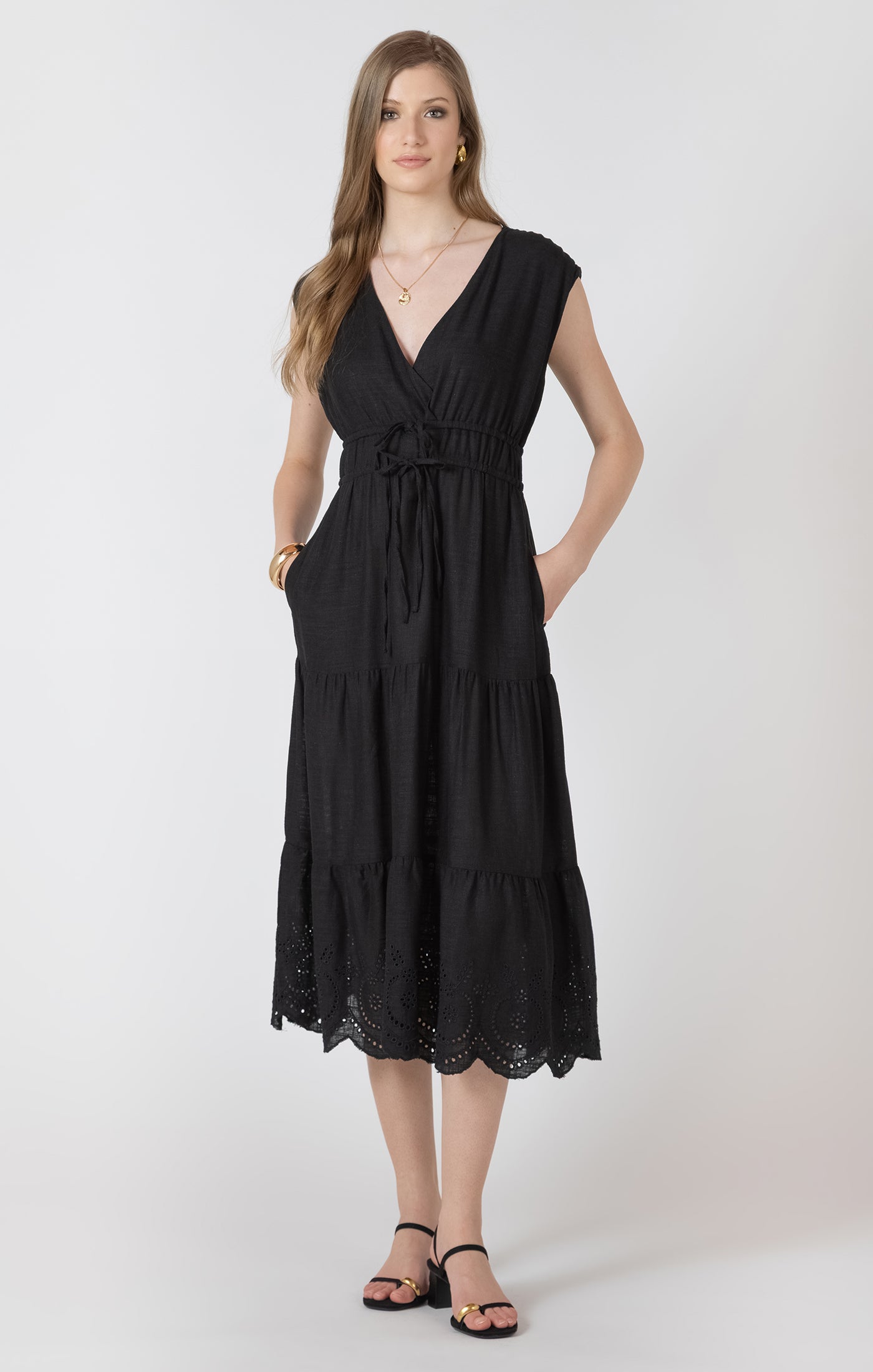 Woman wearing a black dress on a white background