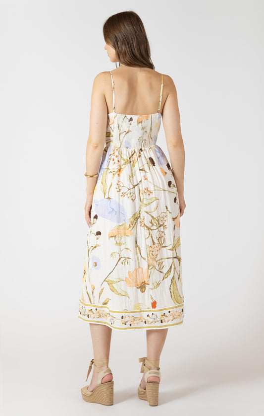 Woman wearing a floral dress on a white background
