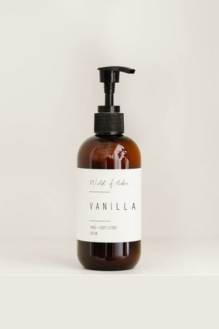 Brown bottle with pump and vanilla label on a white background