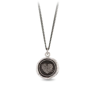Silver necklace with a round pendant on a white background