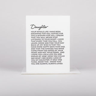 A greeting card with a message printed on it, featuring the word Daughter at the top, set against a white background.