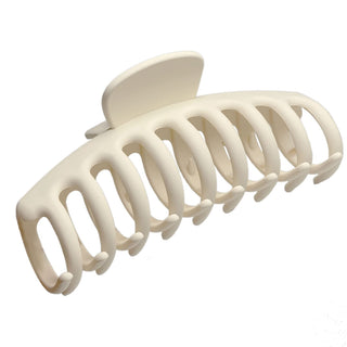 a plastic claw clip in a white colour