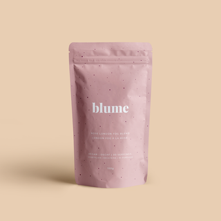 A pink package of Blume tea with the product name 'Rose London Fog' written on it, set against a neutral background.