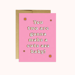 A pink greeting card with white writing. 