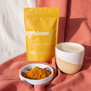 A yellow package of blume Turmeric Blend with a white label displaying the product name and weight '125g = 30 servings'.