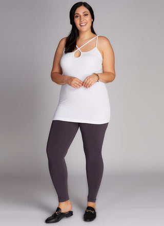 A model wearing black bamboo curvy full-length leggings. 