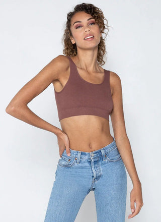 A woman wearing a bamboo bralette with jeans . 