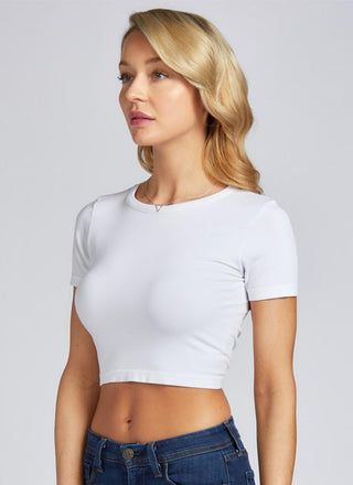 A woman wearing a bamboo cropped short sleeve top. 