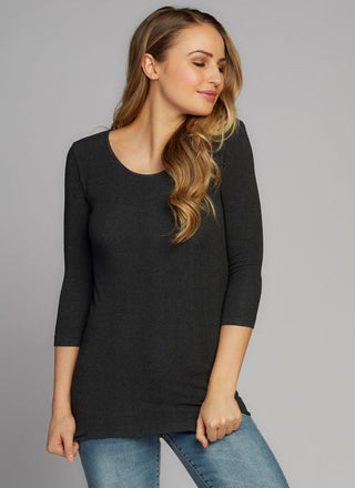 A woman wearing a grey 3/4 sleeve scoop neck top made of bamboo, cotton, nylon, and spandex.