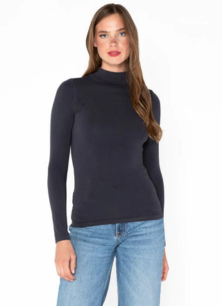 Woman wearing a grey mock neck top made of bamboo