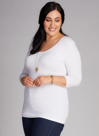 A woman wearing a Curvy bamboo 3/4 sleeve top. 
