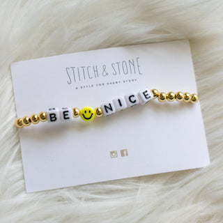 Bracelet with motivational message on wrist against a neutral background