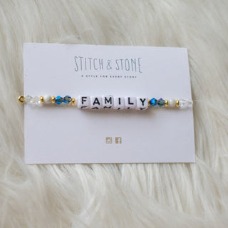 a beaded bracelet that says family on it
