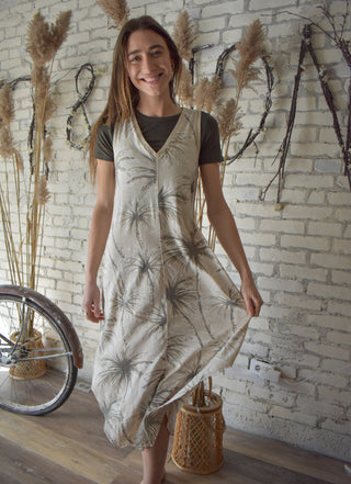 A woman wearing the Bamboo cropped tee under a dress. 
