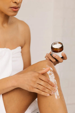 women using k'pure drenched body mosturizer
