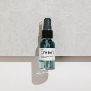 Skincare bottle labeled 'Clean Slate' on a neutral background