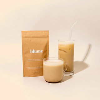 Blume product packaging with two glasses of iced coffee on a light background