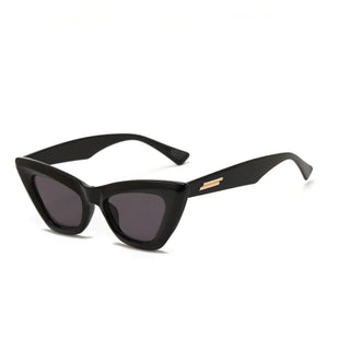 black cat eye shaped sunglasses on a white background