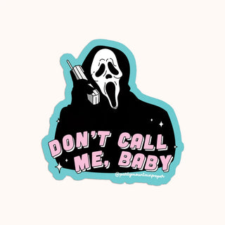 A sticker with a illustration of a white cat with a bow, and the text 'don't call me baby"