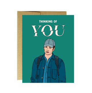 Teal greeting card with text "thinking of you" with image of man from TV show You
