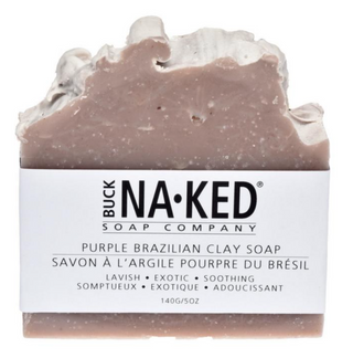 Bar of purple Brazilian clay soap with 'Buck Naked Soap Company' packaging on a white background